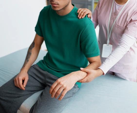 Doctor Helping Patient Rehabilitation Image