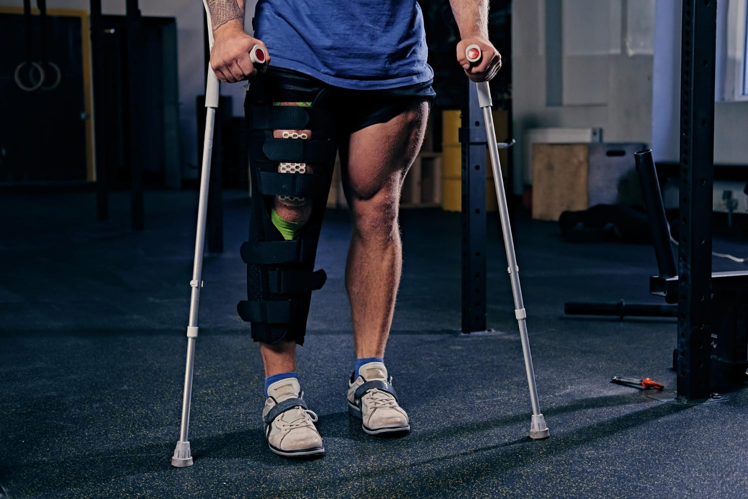 Patient using crutches during recovery from a knee injury after a car accident