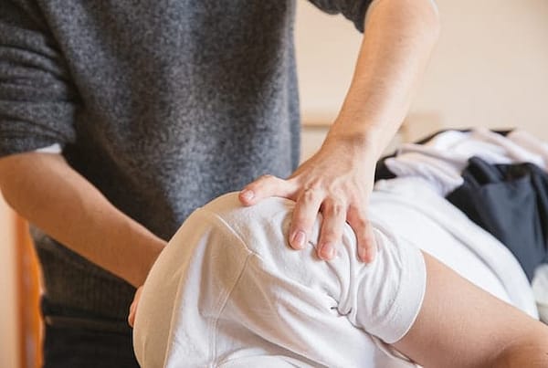 Chiropractor providing hands-on treatment for a patient with a herniated disc