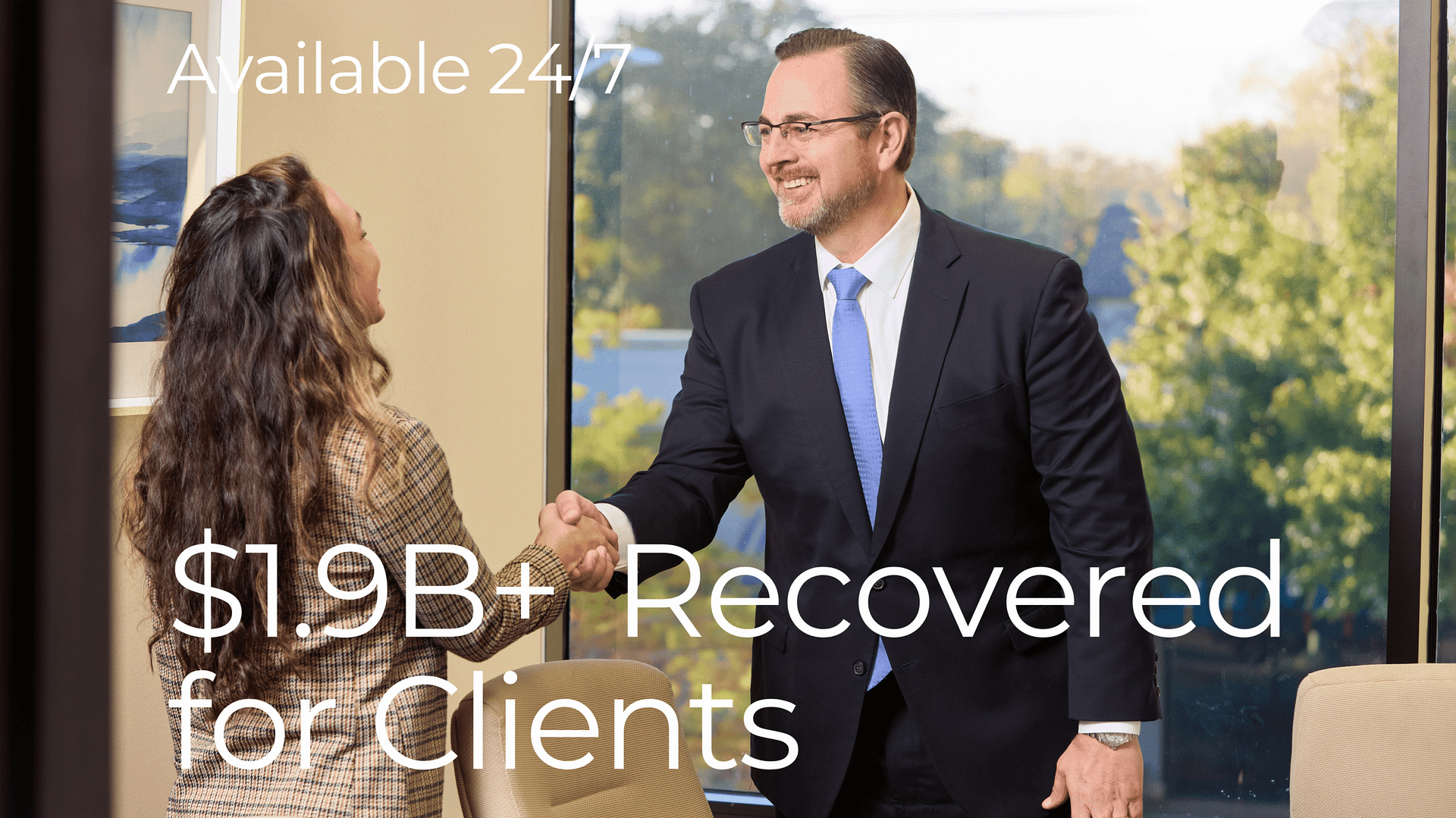 personal injury attorney shaking hands with client after successful case resolution at Thompson Law