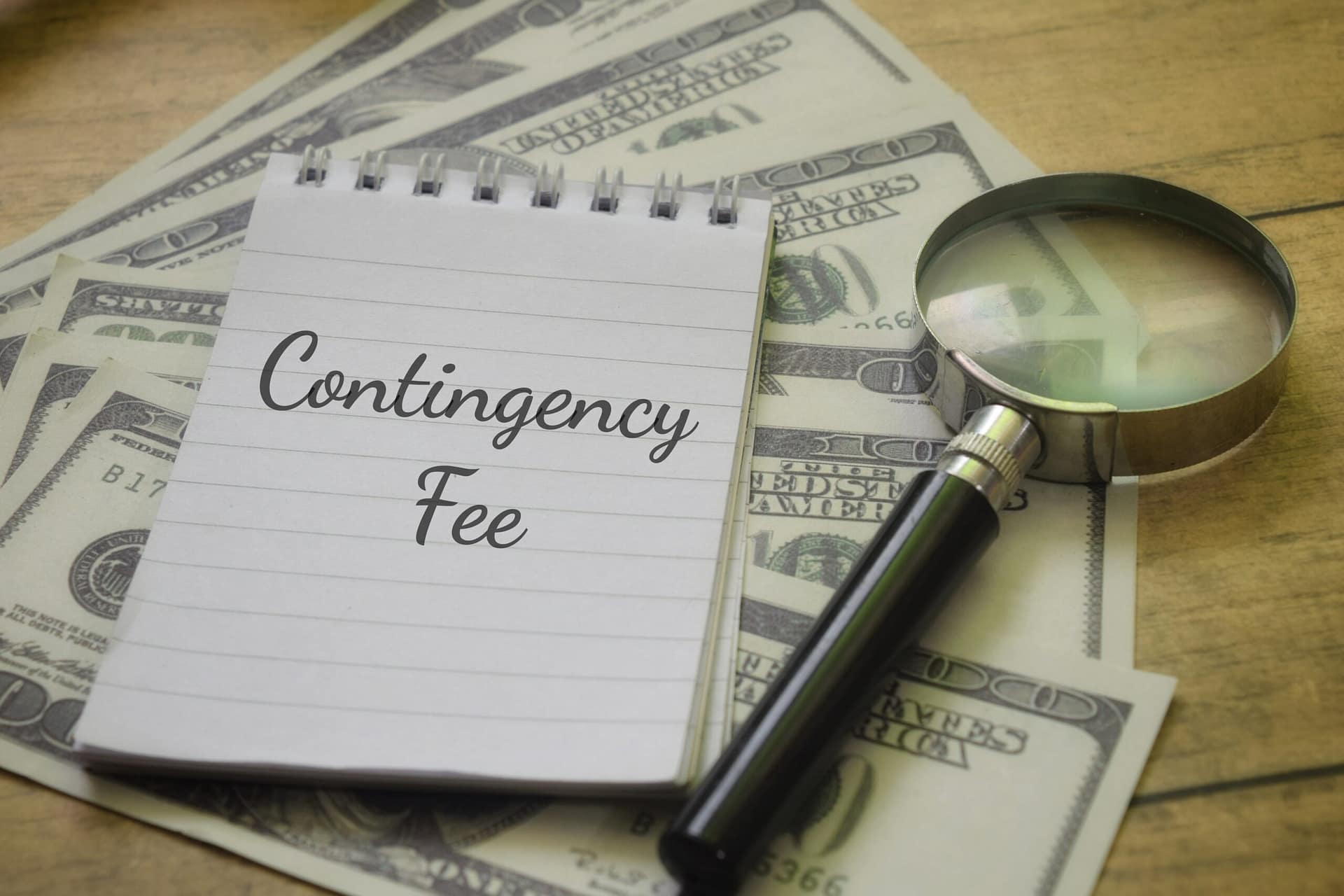 Contingency fee agreement for a personal injury lawyer with legal paperwork and money