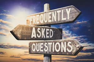 Frequently asked questions - wooden signpost, road sign with three arrows