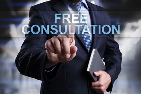 Businessman is pressing on virtual screen and selecting Free consultation. Understand how insurers value an injury claim after a wreck for FREE.