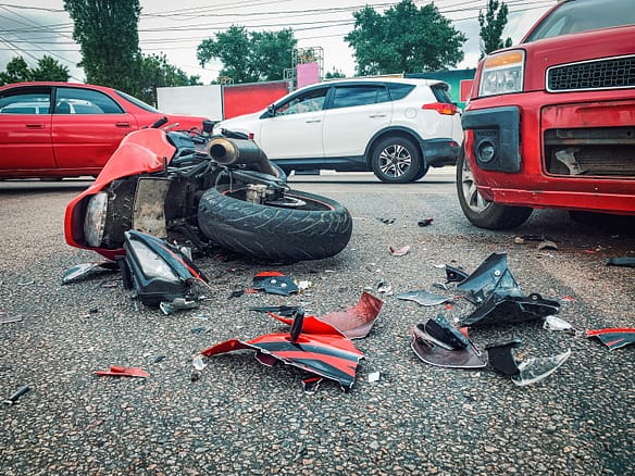 Motorcycle accident and car crash, broken and wrecked Glendale