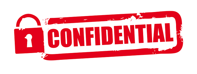 Confidential red grunge rubber stamp on white background.