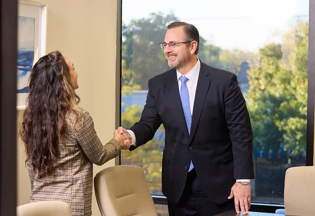 Person meeting with a personal injury attorney to discuss a car accident claim and filing deadlines