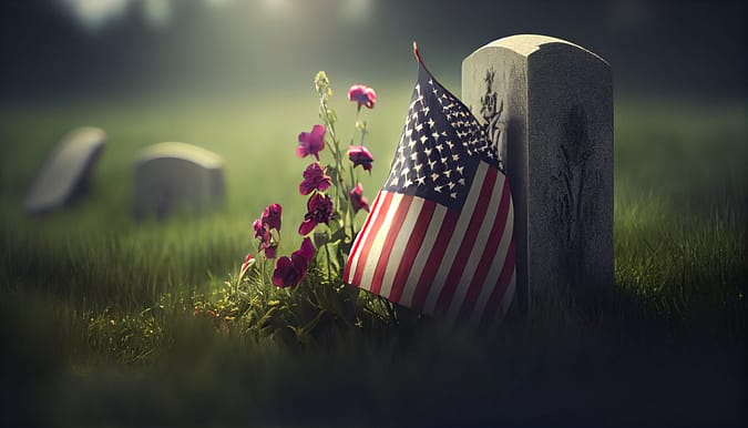 American flag laying on grave at the peaceful flowers. Killeen Wrongful Death Lawyer