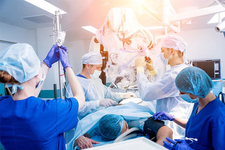 Medical team performing surgery on a patient in an operating room